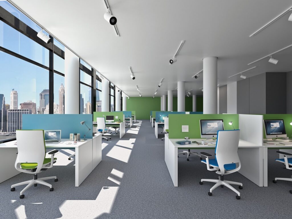 Großraumbüro mit ergonomischen Drehstühlen Mera von Klöber mit weißem Gestell und schwarzen Rollen sowie weißer Rückenschale und Vollpolsterung in blau und grün.